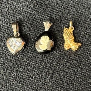 Three vintage necklace pendants